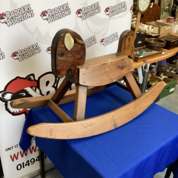 Vintage Canadian rocking horse, classic wooden toy for collectors.