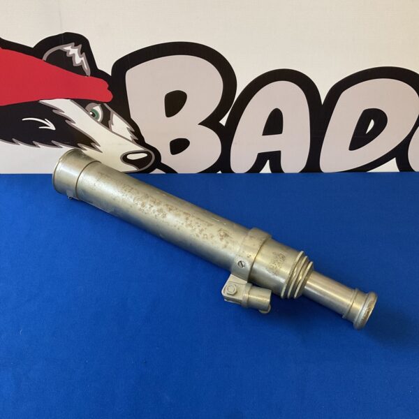 Vintage four-draw telescope on a blue background.