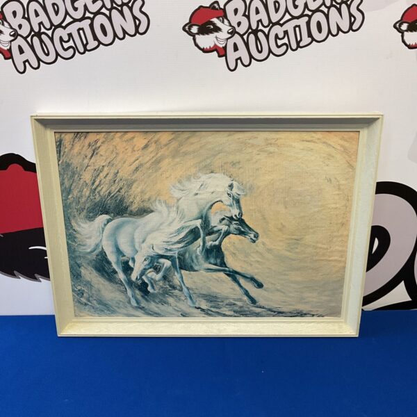 Vintage framed print of white horses in dynamic motion.