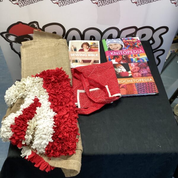 Vintage sewing books and patterns displayed on a table.