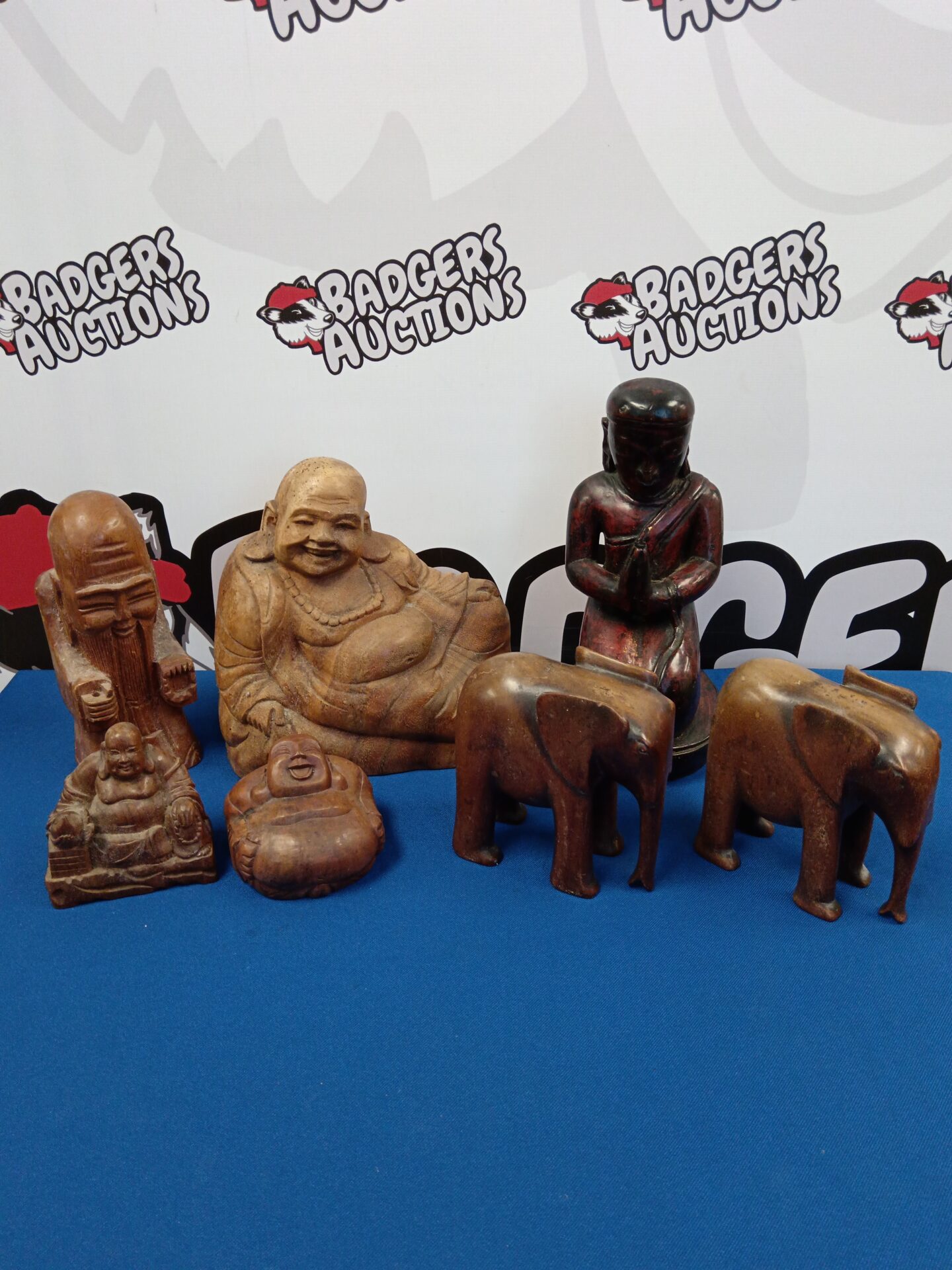 032 Collection of carved wooden Buddhas & elephants