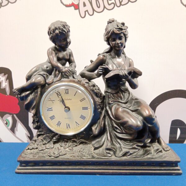 Vintage Juliana mantle clock with girl and child sculpture.