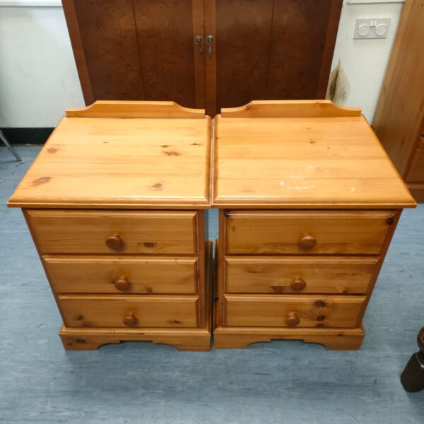 Pair of vintage pine bedside cabinets with a single drawer.