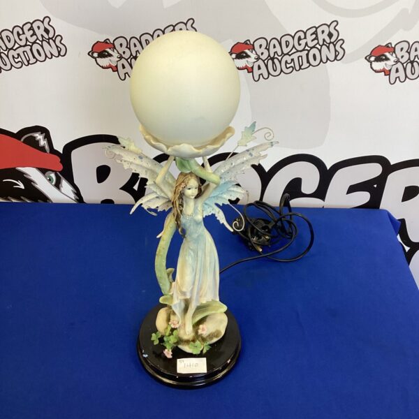 Vintage fairy lamp with porcelain figure and cream shade.