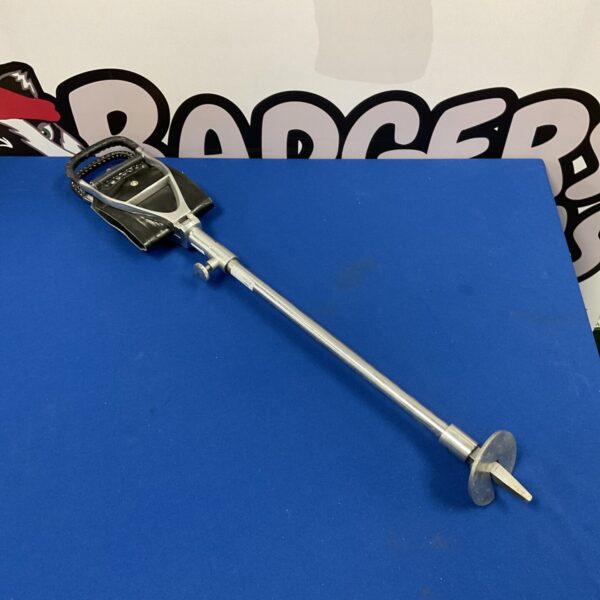 Vintage shooting stick with leather seat for hunting and target practice.