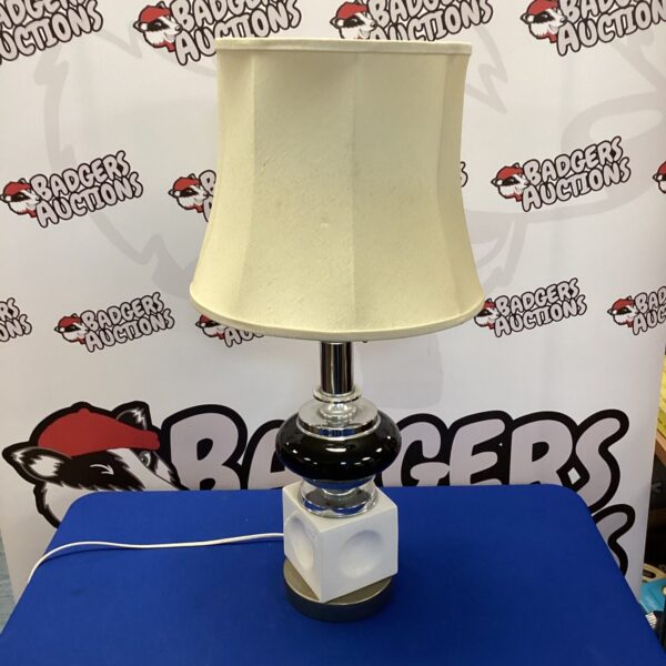 Vintage black and white table lamp with classic design.