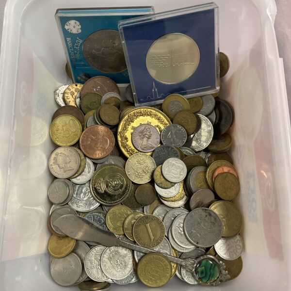 Assorted coin lot with a variety of world currencies.