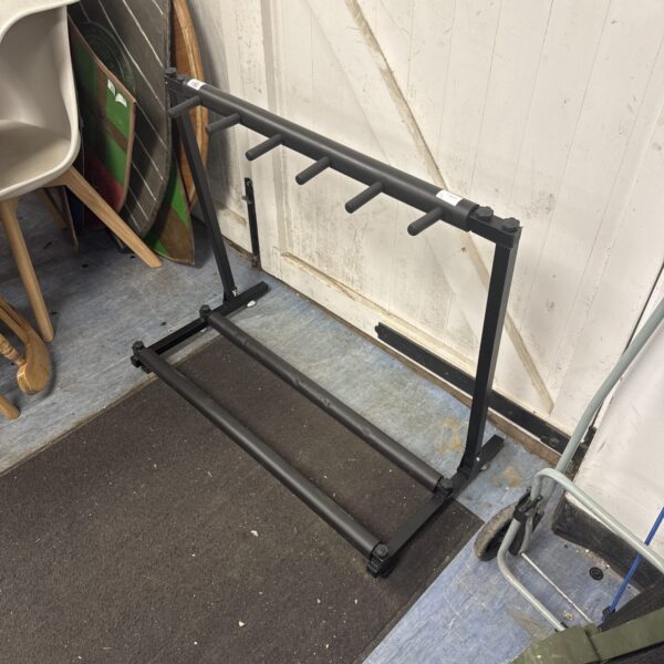 Black metal guitar stand for acoustic or electric guitars.