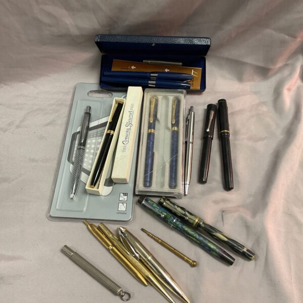 Vintage fountain pen collection including Conway Stewart and Parker pens.