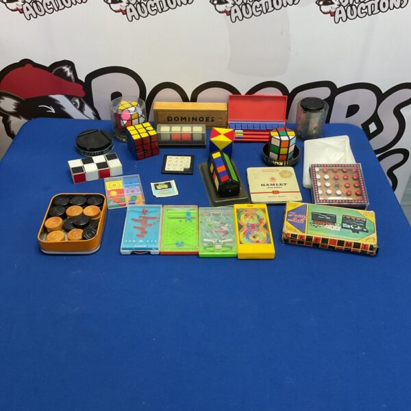 Vintage lot of games and puzzles including Rubik's Cubes and Tomy Poketeers.