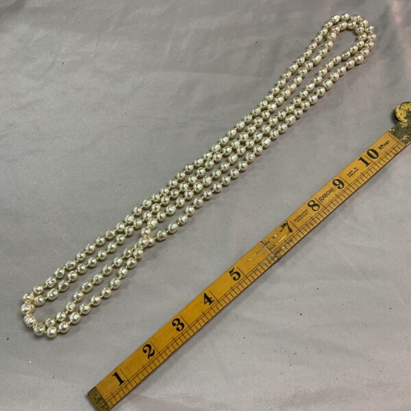 Long strand of faux pearl necklace, vintage jewellery.