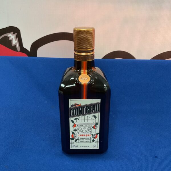 Sealed vintage bottle of Cointreau L’Unique liqueur from 1949.