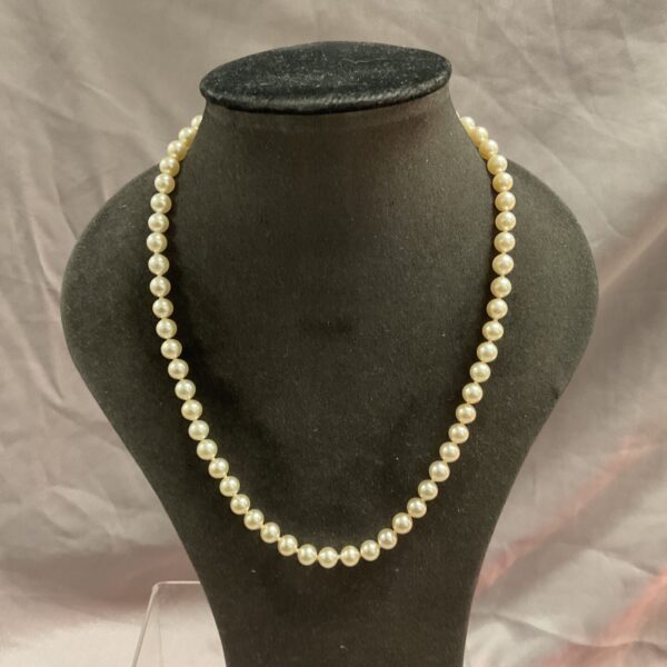 Elegant cultured pearl necklace by James Walker with silver gilt clasp.
