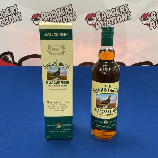 Sealed bottle of The Famous Grouse Islay Cask Finished Scotch Whisky.