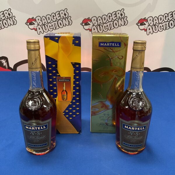 Two sealed bottles of Martell cognac in original packaging.