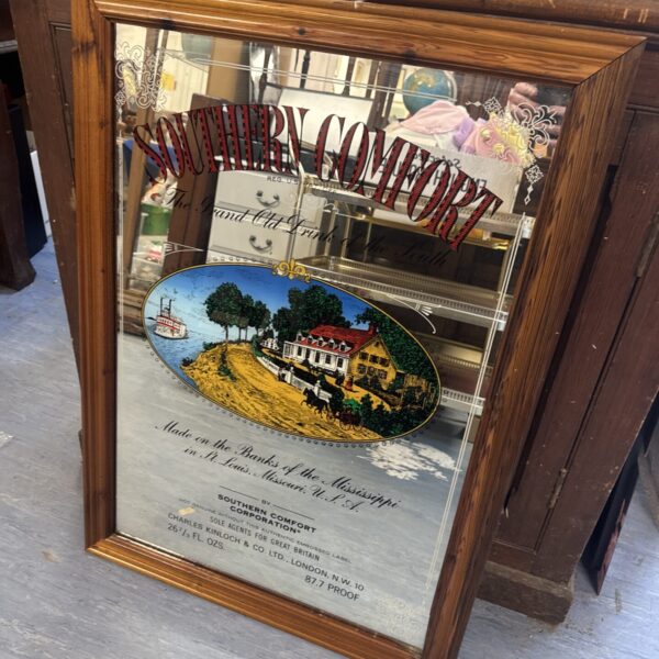 Vintage Southern Comfort pub mirror with detailed illustration.