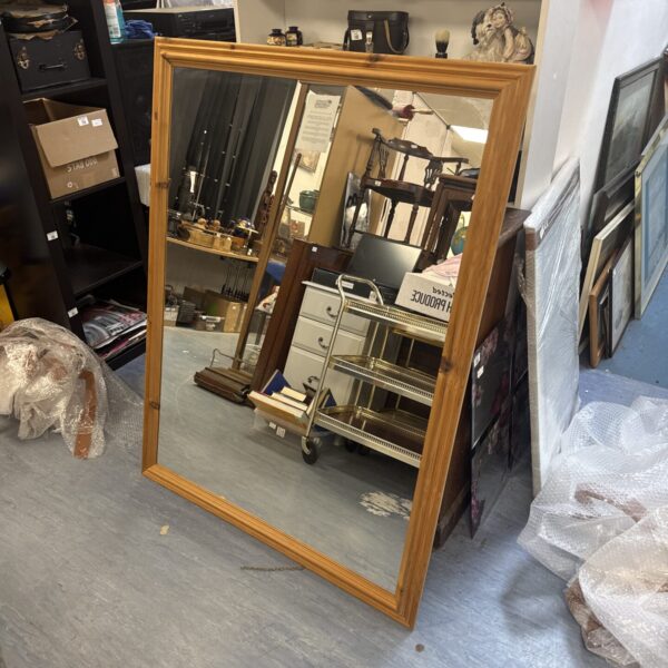 Large pine framed mirror with rustic farmhouse style.