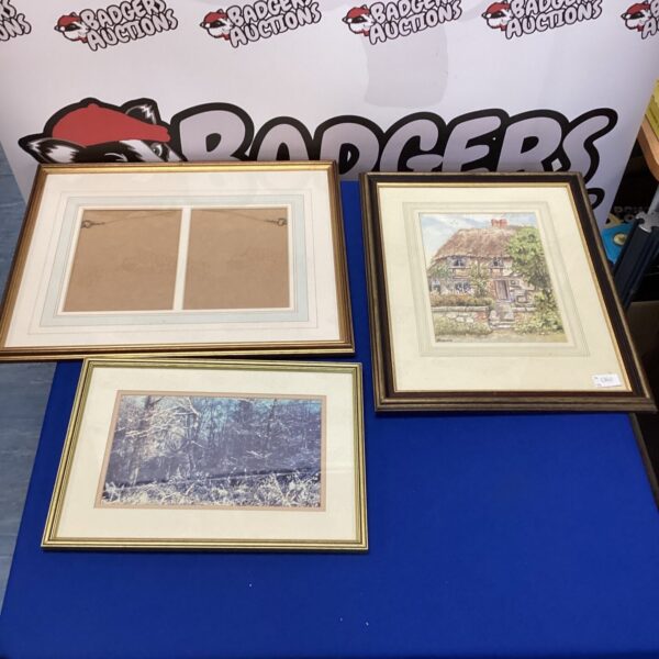 Vintage picture frames with artwork, including a signed piece.