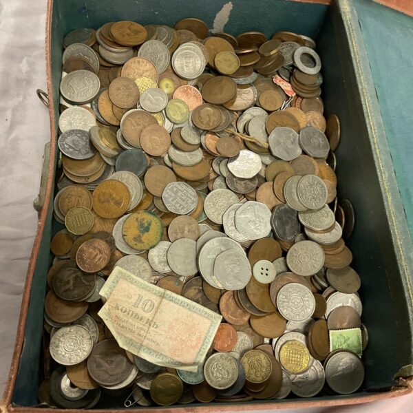 Vintage assorted coin lot in an old suitcase.