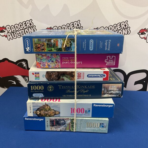 Lot of six jigsaw puzzles including gibsons and Ravensburger brands.