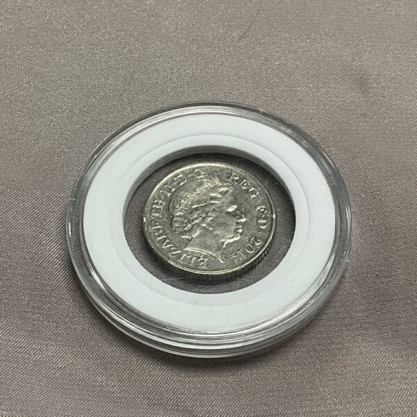 Rare 2014 double-headed 10p coin in display case.