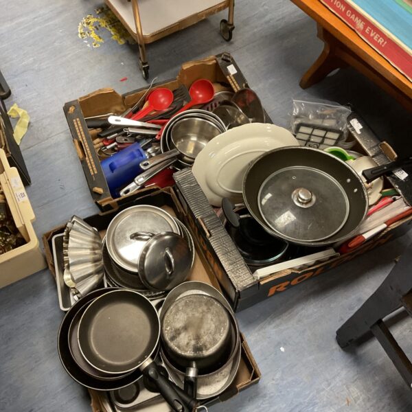 Stainless steel cookware set with various pots and pans.