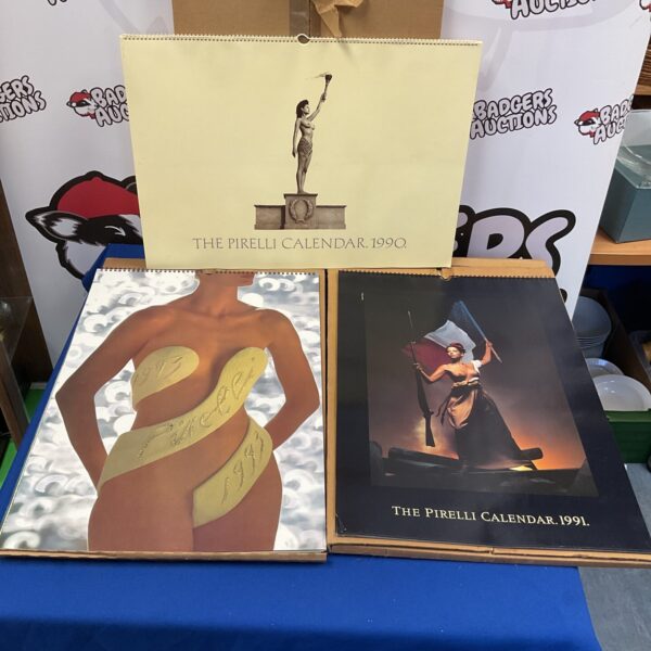 Vintage Pirelli calendars from 1990, 1991, and 1993, collectible art.