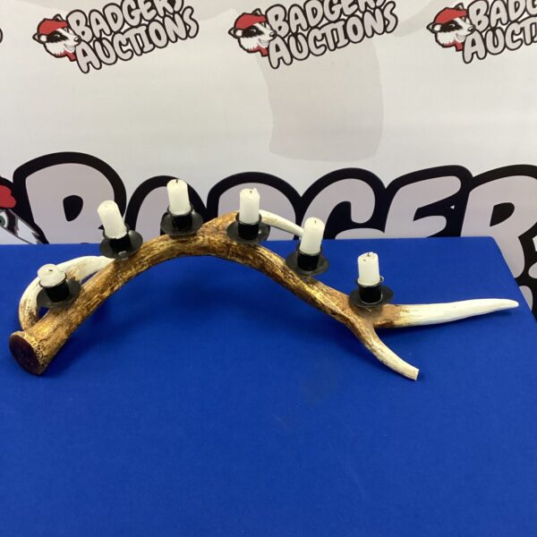 Detailed faux stag antler candelabra for warm home lighting.