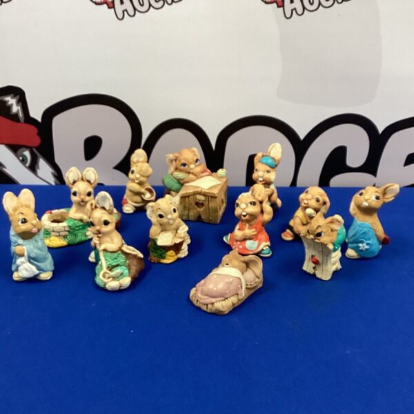 Vintage Pendelfin rabbit figurines in a collectible display.