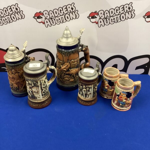 Vintage German steins collection with a Gerzit stein.