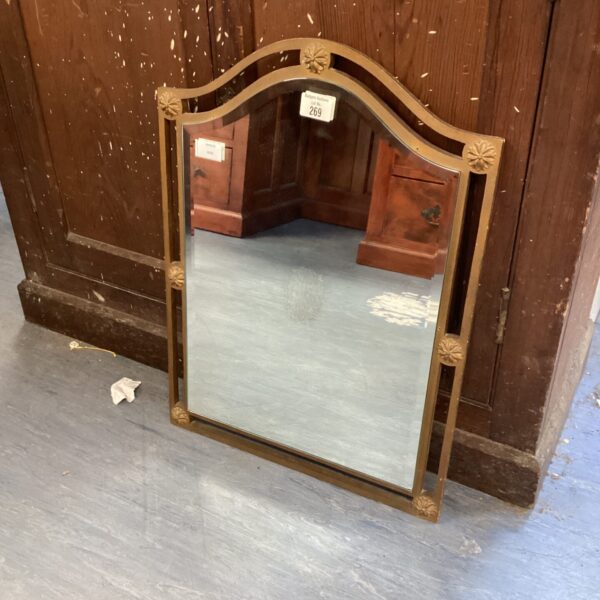 Vintage bevelled hallway mirror with decorative frame.
