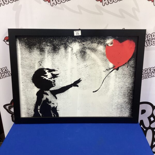 Canvas print of Banksy’s Girl with Red Balloon artwork for wall decor.