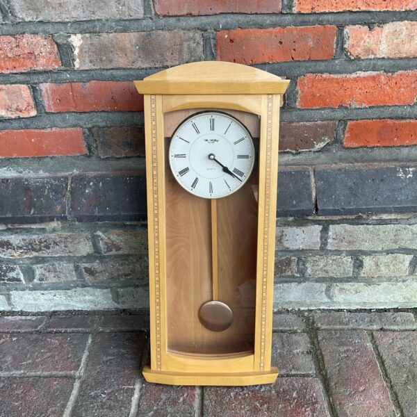 Vintage Wm Widdop quartz wall clock with light oak case.