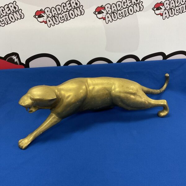 Detailed brass jaguar statue, vintage animal sculpture.