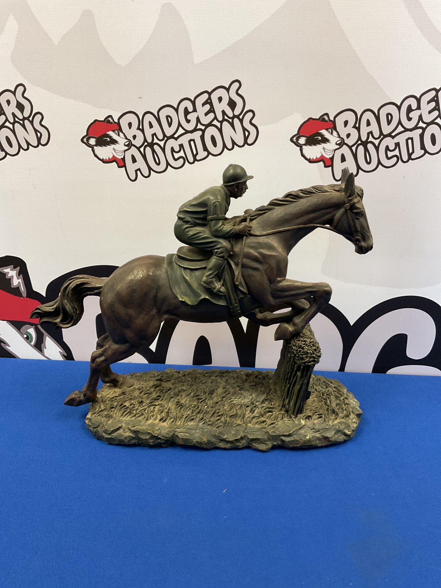 012 Resin sculpture of a race horse over jumps