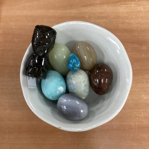 Assorted decorative eggs displayed together, colourful ornamental collection.