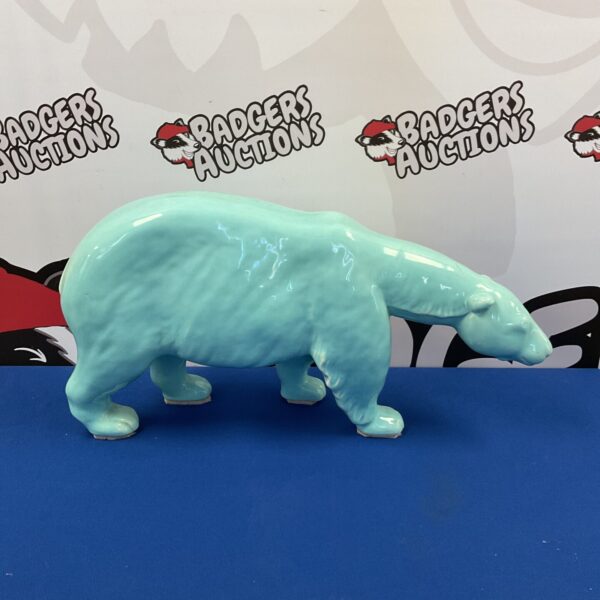 Large blue ceramic polar bear sculpture for home decor.