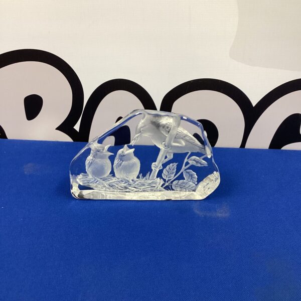 Detailed engraved glass bird sculpture for home decor.