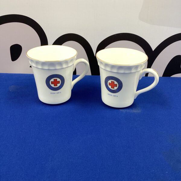 Pair of vintage British Red Cross commemorative porcelain mugs.