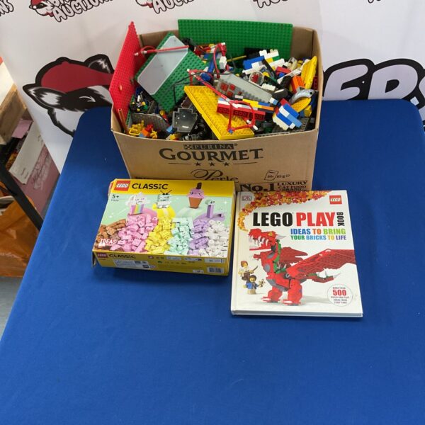 Mixed Lego lot with colourful bricks and minifigures for building.