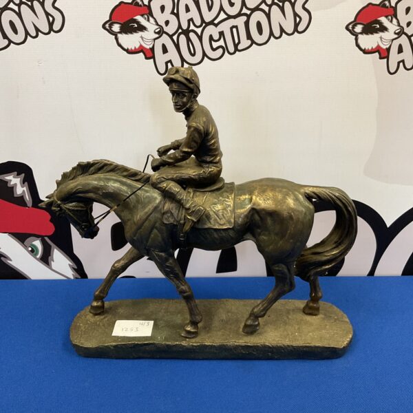Detailed bronze sculpture of a racehorse and jockey.