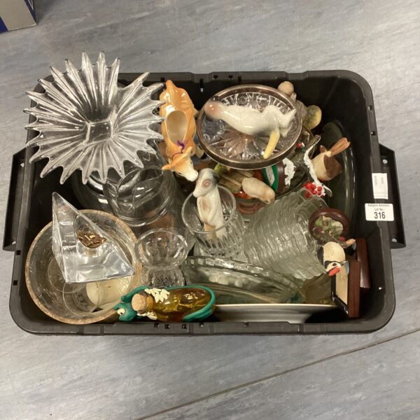 Mixed lot of vintage glassware and china collectibles on display.