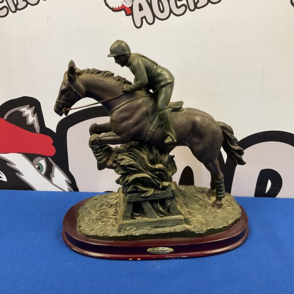 Detailed Wellington Collection racehorse and jockey sculpture.