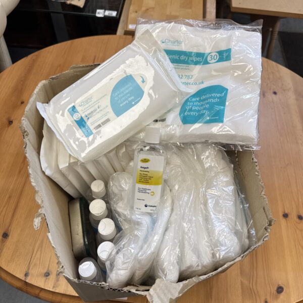 Close-up of medical wipes and hand gel packaging in a lot.