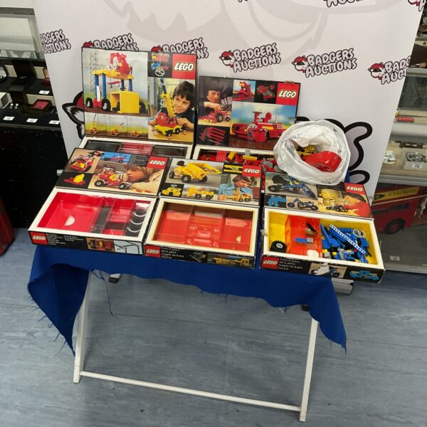 Vintage Lego sets and parts in a collectible lot.
