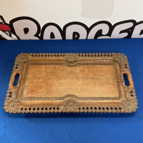 Vintage hand-carved wooden tray with daisy pattern.