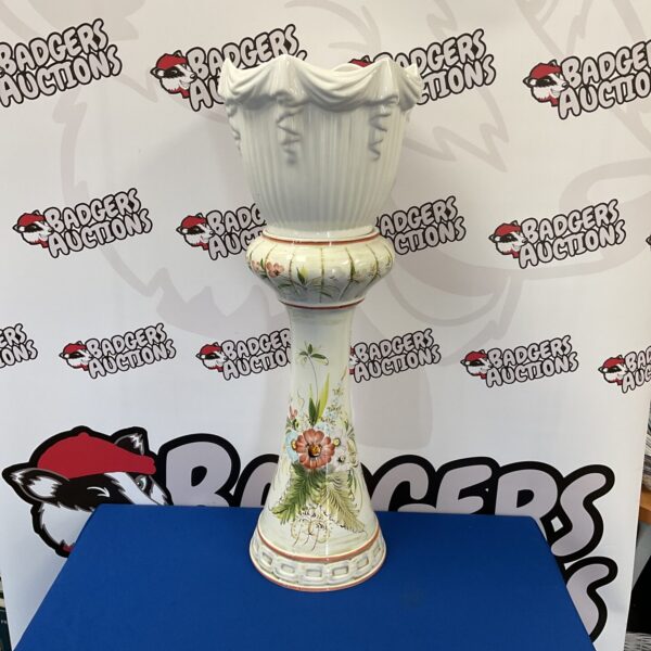 Hand painted porcelain jardiniere with floral design.