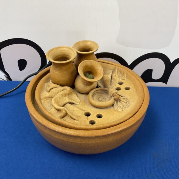 Pottery water feature fountain for indoor use.