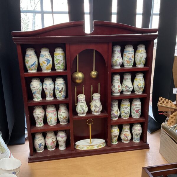 Vintage Lenox spice jar rack with floral porcelain jars.