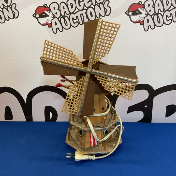 Vintage wooden windmill table lamp with detailed sails.